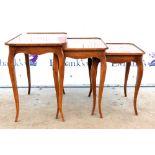 20th century French kingwood nest of three tables, one with marquetry floral inlay, all on