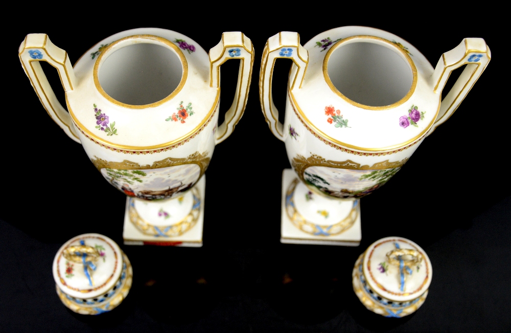 A pair of two handled Continental porcelain urns and covers with central cartouches painted with - Image 4 of 5