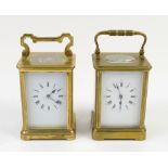 A brass corniche cased carriage clock, the white dial with Roman and Arabic numerals, bevelled glass