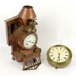 Copper clock in the form of an American steam locomotive with cowcatcher, white enamel dial with
