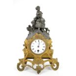 19th century French single train mantel clock, with figural surmount, white enamelled dial with
