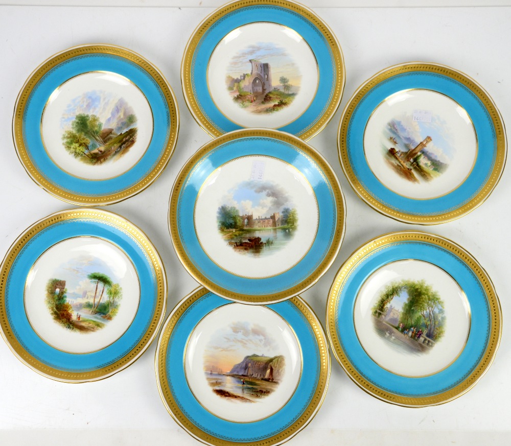 Minton part dessert service each piece painted with a Scenic view within turquoise and gilt tooled