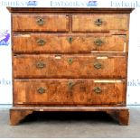 18th century walnut veneered chest of two short crossbanded drawers over three further long