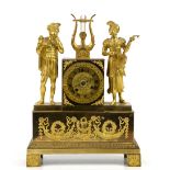 Early 20th century French gilt metal twin train mantel clock with Roman numerals, figural