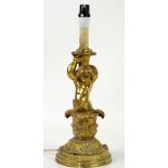 Messenger & Sons brass table lamp in the form of a cherub holding aloft a basket, emerging from
