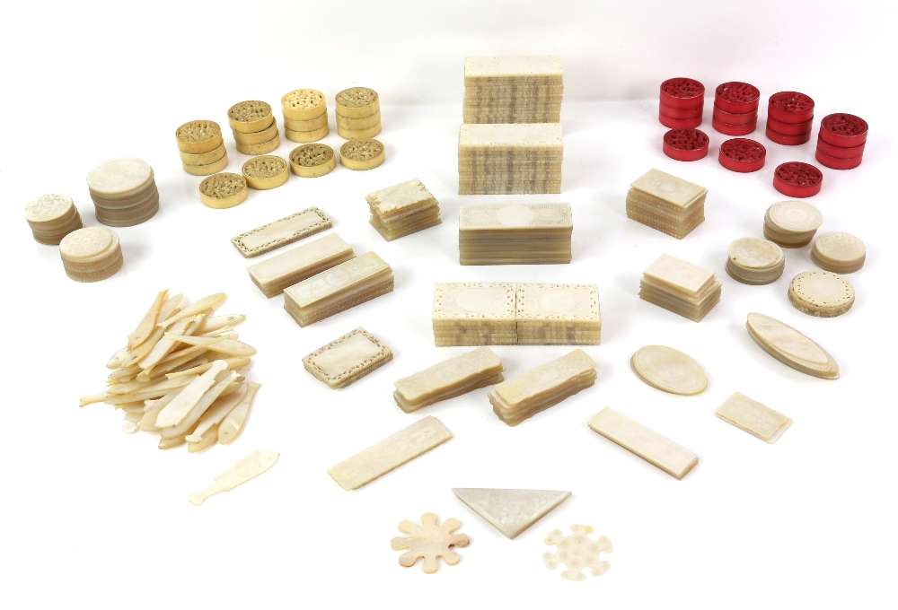 Collection of over 200 mother-of-pearl games counters of various shapes to include fish,