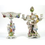 German porcelain four light candelabra the central trunk held up by two putti, 46cm and a Dresden