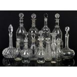 Collection of early 19th century and later decanters and oil and vinegar bottles, some with etched