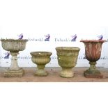 Four garden planters, to include terracotta planter of floral design, H65 x W47 x D47cm, a composite