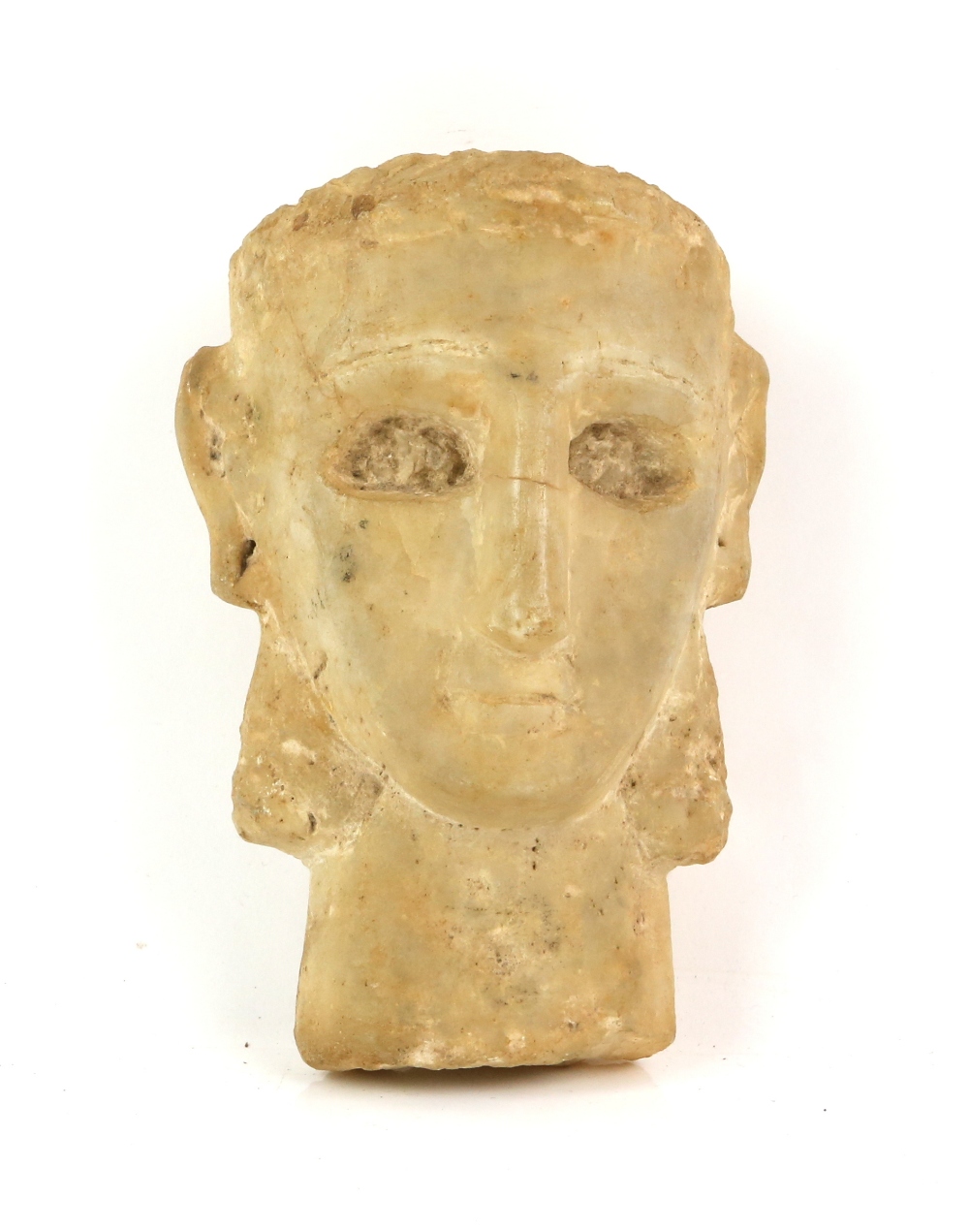 South Arabian alabaster head of a woman with deeply recessed eyes, incised eyebrow, straight nose