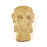 South Arabian alabaster head of a woman with deeply recessed eyes, incised eyebrow, straight nose