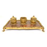 French rosewood and gilt metal desk stand with scrolling foliate decoration with two inkwells and