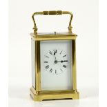 French brass corniche cased repeating carriage clock, white enamel dial with Roman numerals,
