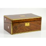 19th century mahogany and brass bordered writing slope, the hinged top opening to reveal a leather