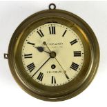Brass cased bulkhead clock, the 6.5 inch Roman dial signed Clayton & Son, Ships Chandlers,