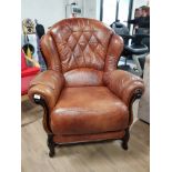 LEATHER BUTTON BACK ARMCHAIR WITH WOOD FRAME AND FLARED ARMS