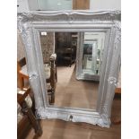 30X20 BEVELLED MIRROR IN AN ORNATE FRAME WITH SCROLLED EDGES