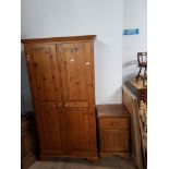PINE DOUBLE DOOR WARDROBE TOGETHER WITH SINGLE DRAWER OVER CUPBOARD BEDSIDE CHEST