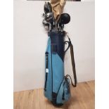 A GOLF BAG CONTAINING ASSORTED GOLF CLUBS