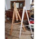 A LARGE PINE STANDING EASEL PLUS ONE OTHER