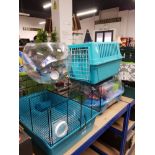 A PET CARRIER TOGETHER WITH HAMSTER CAGES ETC