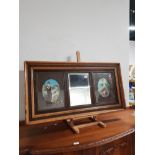 CARVED WOODEN FRAMED BEVELLED MIRROR WITH SIDE BY SIDE OVAL SHAPED PRINTS OF LADIES