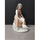 NAO FIGURINE OF A LADY FEEDING A GOOSE