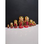 A PAIR OF 4 PIECE RUSSIAN DOLL SETS