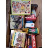 A BOX OF ASSORTED GAMES INC STAY ALIVE TRAIN JIGSAWS ETC