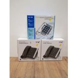 A PAIR OF BOXED BT CORDED TELEPHONES TOGETHER WITH A BOXED CLEAR SOUND CL100 TELEPHONE