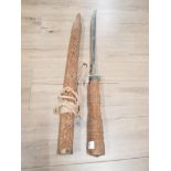VINTAGE SWORD WITH HEAVILY CARVED HANDLE AND SHEATH