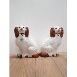 A PAIR OF STAFFORDSHIRE STYLE DOG ORNAMENTS