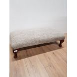 A LARGE FOOTSTOOL WITH MAHOGANY FEET