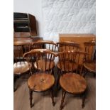 A SET OF 6 STAINED PINE WINDSOR STICK BACK CHAIRS