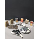 A BOX CONTAINING MISCELLANEOUS ITEMS SUCH AS BELT BUCKLES AND VINTAGE ZIPPO STYLE LIGHTERS INC