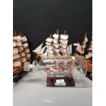 BOUNTY SHIP IN A BOTTLE TOGETHER WITH 3 GALLEONS INC H M S VICTORY MAYFLOWER AND CONSTITUTION
