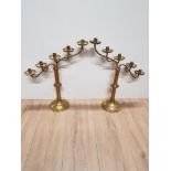 A PAIR OF BRASS 5 BRANCH CHURCH CANDLE HOLDERS