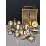 LOT CONTAINING WILLIAM WIDDOP BRASS QUARTZ CARRIAGE CLOCK WITH 12 MINATURE BRASS CLOCKS