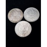 3 SILVER UNITED STATES OF AMERICA 1 DOLLAR COINS DATED 1884 1885 AND 1886