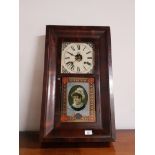 VICTORIAN MAHOGANY WALL CLOCK BY WATERBURY CLOCK COMPANY WITH WEIGHTS PENDULUM AND KEY