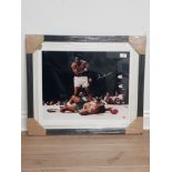 FRAMED PHOTOGRAPH OF MUHAMMAD ALI VS SONNY LISTON THE PHANTOM PUNCH SIGNED BY ALI AND WITH