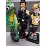 3 LARGE FIGURES INCLUDE PORCELAIN CHARLIE CHAPLIN AND PAINTED WOODEN FROG TABLE BASE MISSING LEAF