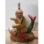 HAND CARVED AND PAINTED WOODEN CHINESE MAN ON FISH