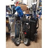 3 GOLF BAGS CONTAINING CLUBS TOGETHER WITH 2 GOLF TROLLEYS
