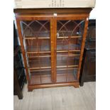 WALNUT REGENCY STYLE BOOKCASE