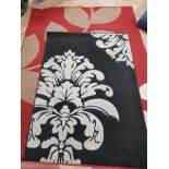 2 FLORAL PATTERNED MODERN RUGS IN RED 156CM X 111CM AND BLACK 227CM X 161CM