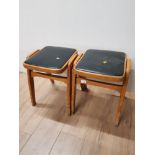 PAIR OF OAK FRAMED STOOLS WITH BLACK LEATHER SEAT PADS