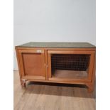 A WOODEN RABBIT HUTCH