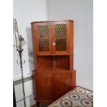 1960S OAK SCANDINAVIAN CORNER CABINET WITH AMBER GLASS PANELLED DOORS