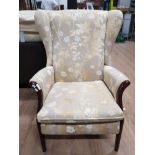 PARKER KNOLL UPHOLSTERED FLORAL PATTERNED FIRESIDE WING BACK ARMCHAIR